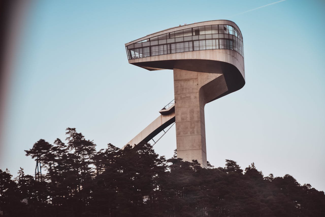 Modern architecture of Bergisel Ski Jump in Innsbruck against clear sky.